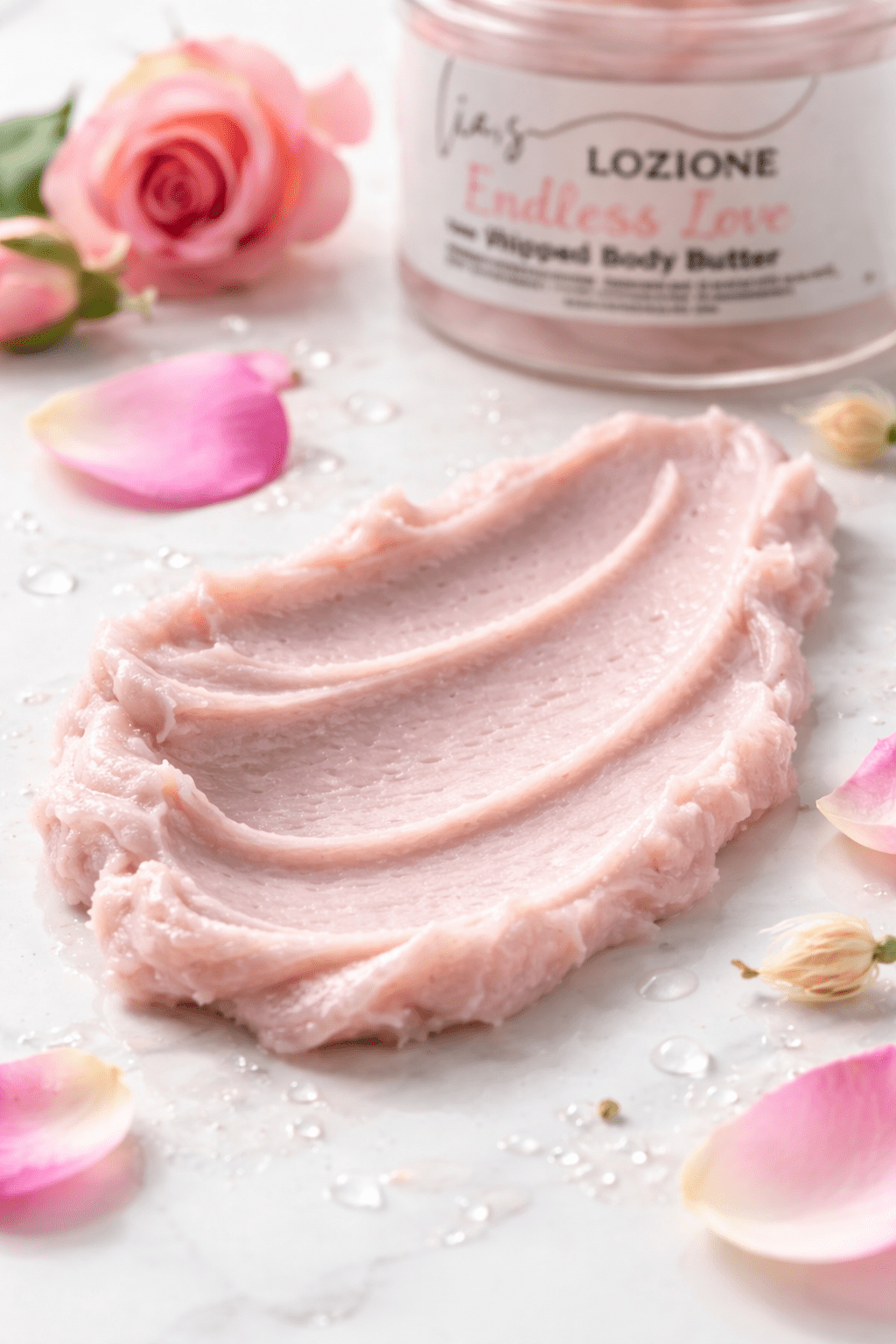 Whipped pink body butter with rose petals
