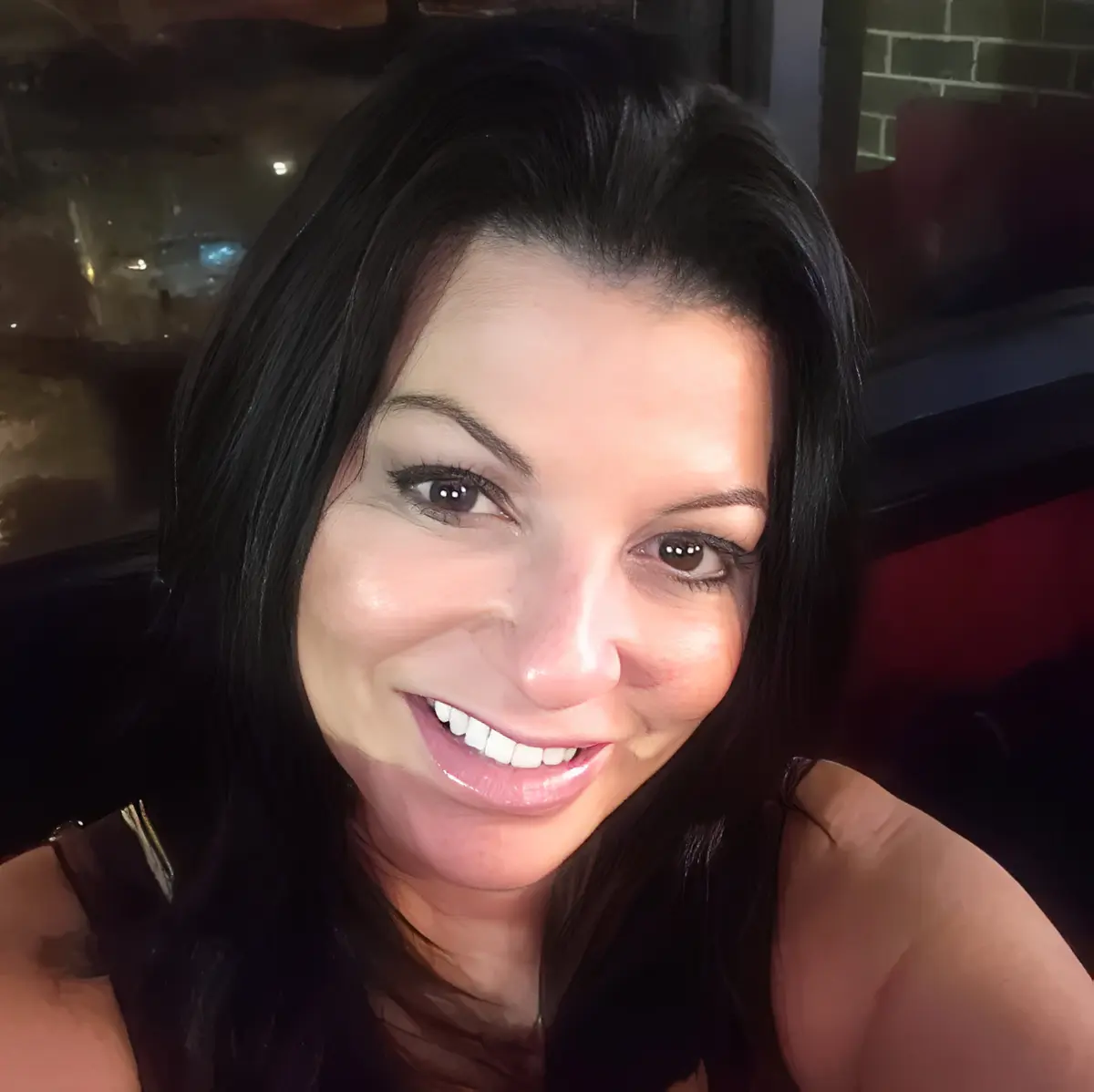Close-up smiling woman with dark hair