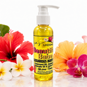 Beautiful Babe 4 OZ Body Oil Bottle surrounded by beautiful tropical flowers
