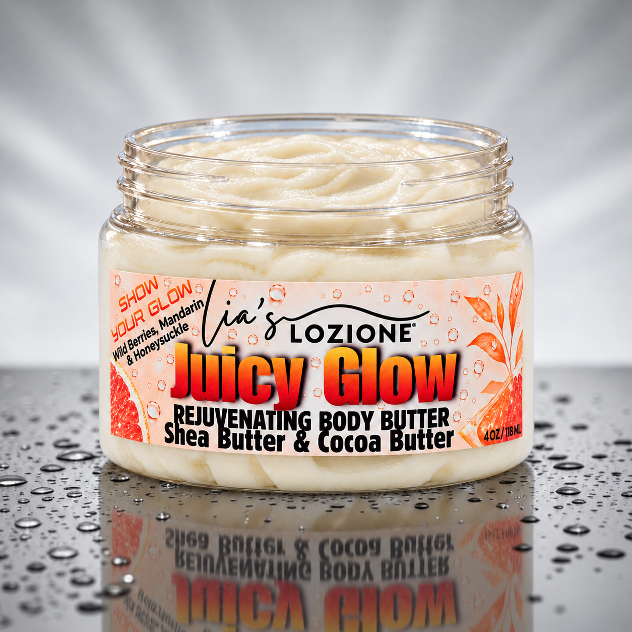 Jar of Juicy Glow, Whipped Body Butter, size 4 OZ, by Lia's Lozione. The Scent is Wild berries , mandarin, honeysuckle, gardenia, jasmine. Along with the aroma of amber, caramel, sandalwood, vanilla and praline.