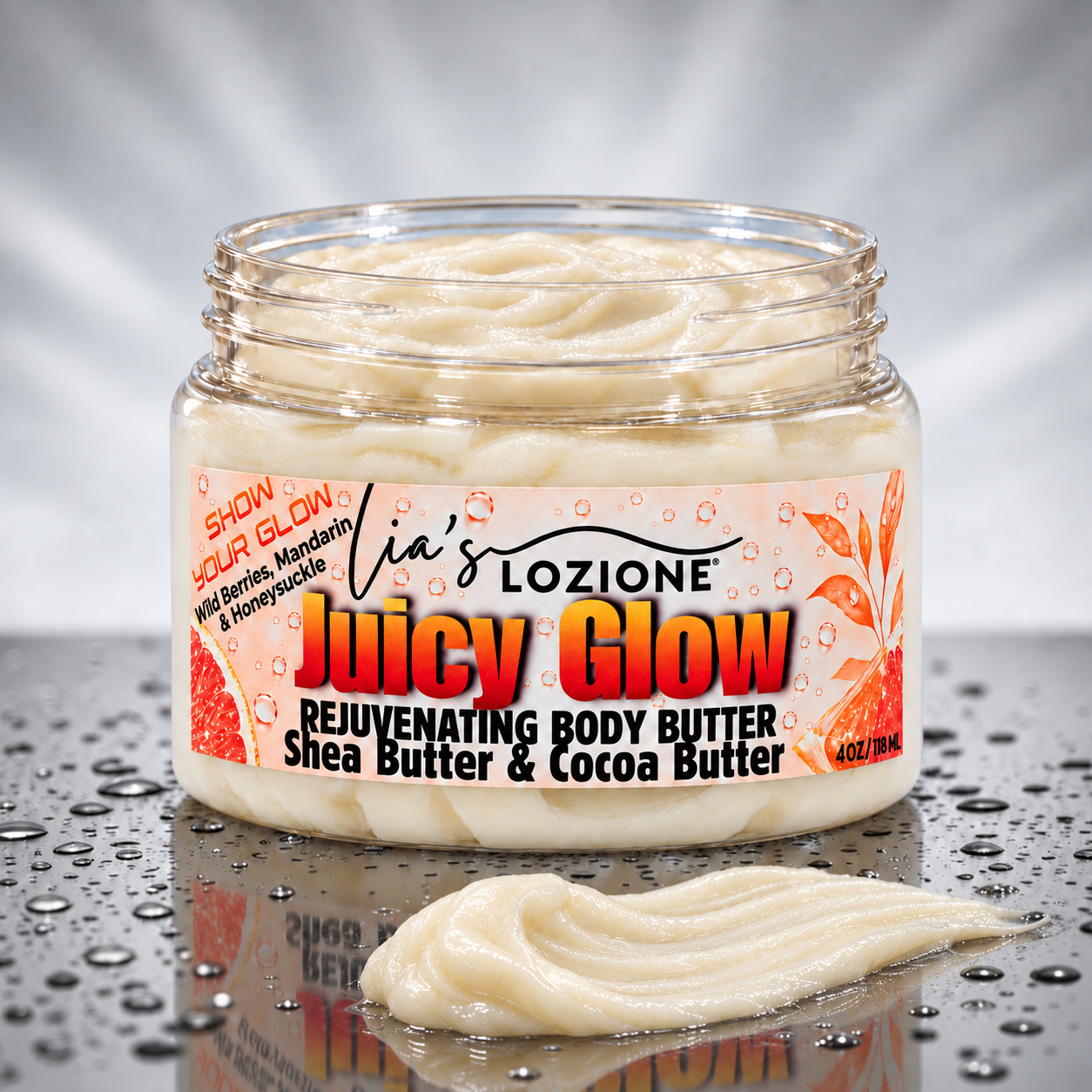 Jar with LID OFF and a Body Butter SMEAR of Juicy Glow Whipped Body Butter, size 4 OZ, by Lia's Lozione. The Scent is Wild berries , mandarin, honeysuckle, gardenia, jasmine. Along with the aroma of amber, caramel, sandalwood, vanilla and praline.