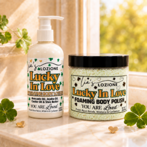 Lucky In Love 8 oz Body Lotion Bottle and 10 oz Body Polish Jar in a beautiful setting with hearts and four leaf clovers